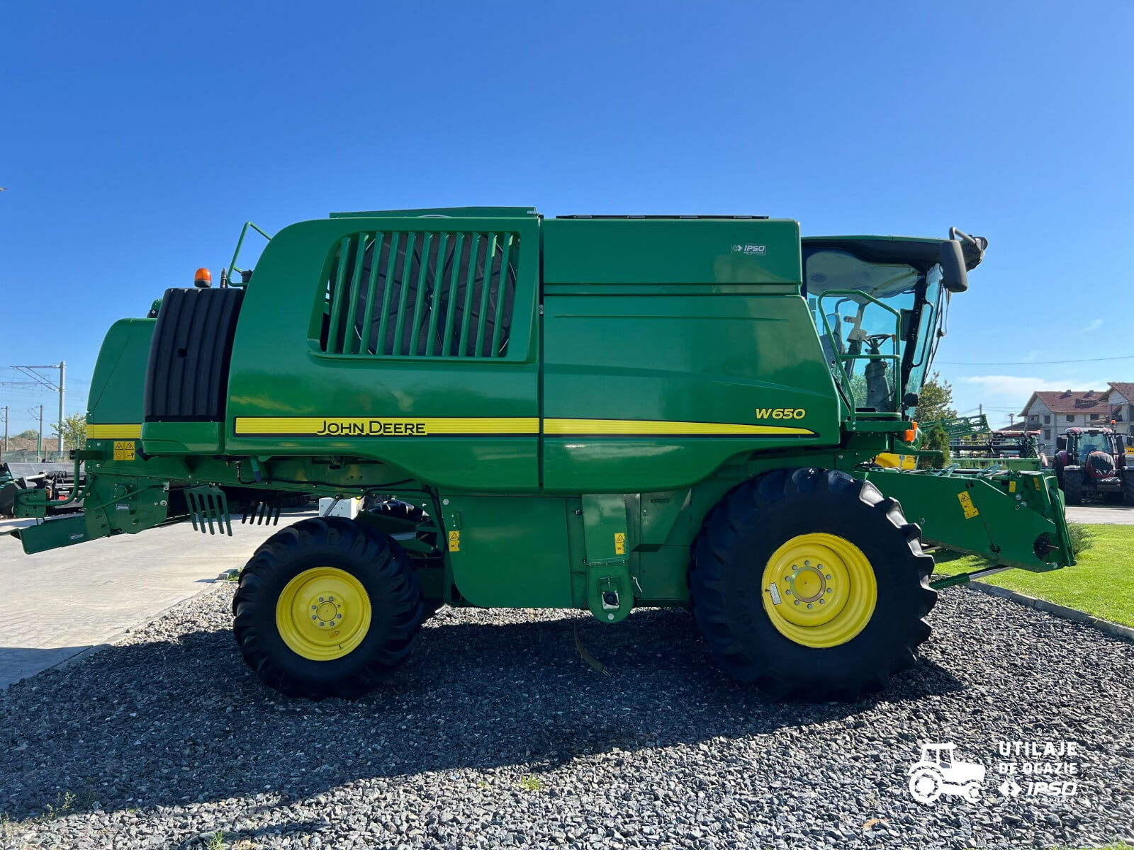 John Deere W650 + Header paioase