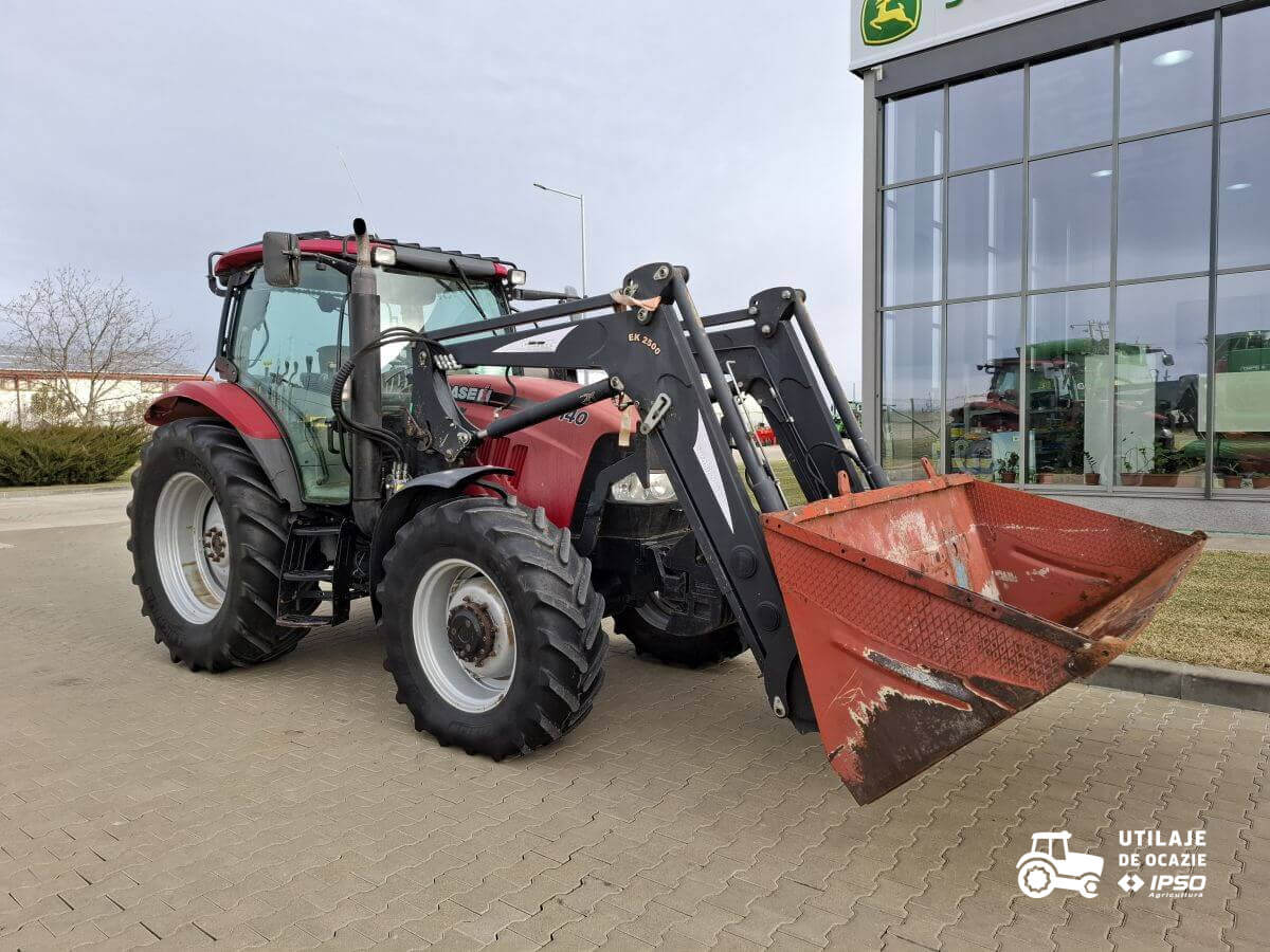 Case Maxxum 140 + incarcator + roti inguste